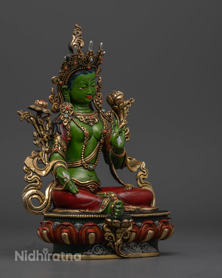 It presents right side of green tara statue highlight her varada mudra and leg extended position