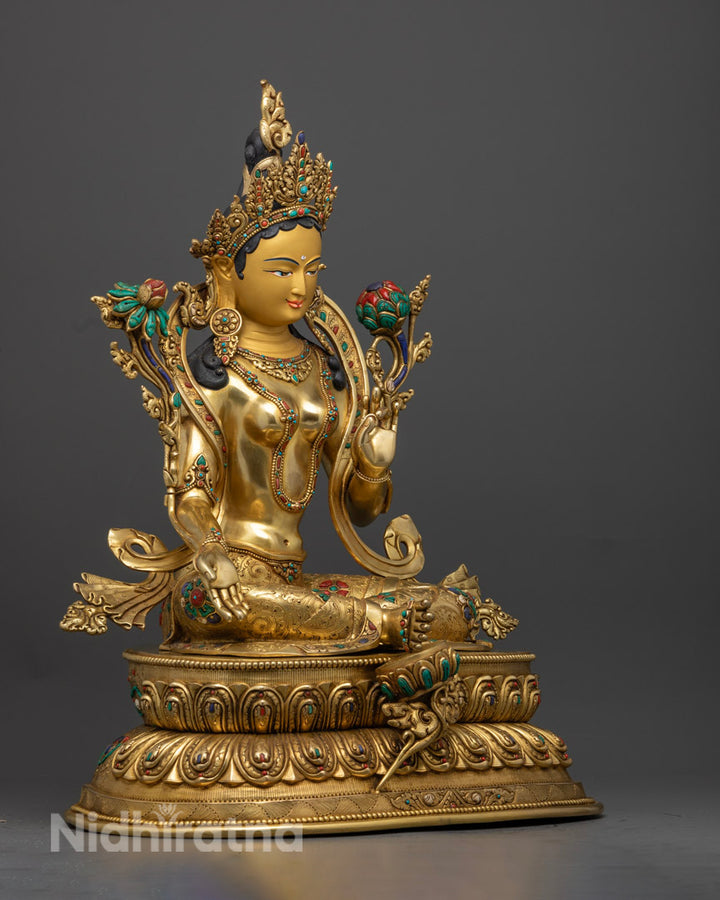 Right side view of Golden Tara Statue showcasing Varada Mudra and Turquoise and Coral Stones in lotus flower, jewelries, and 5 jeweled crown