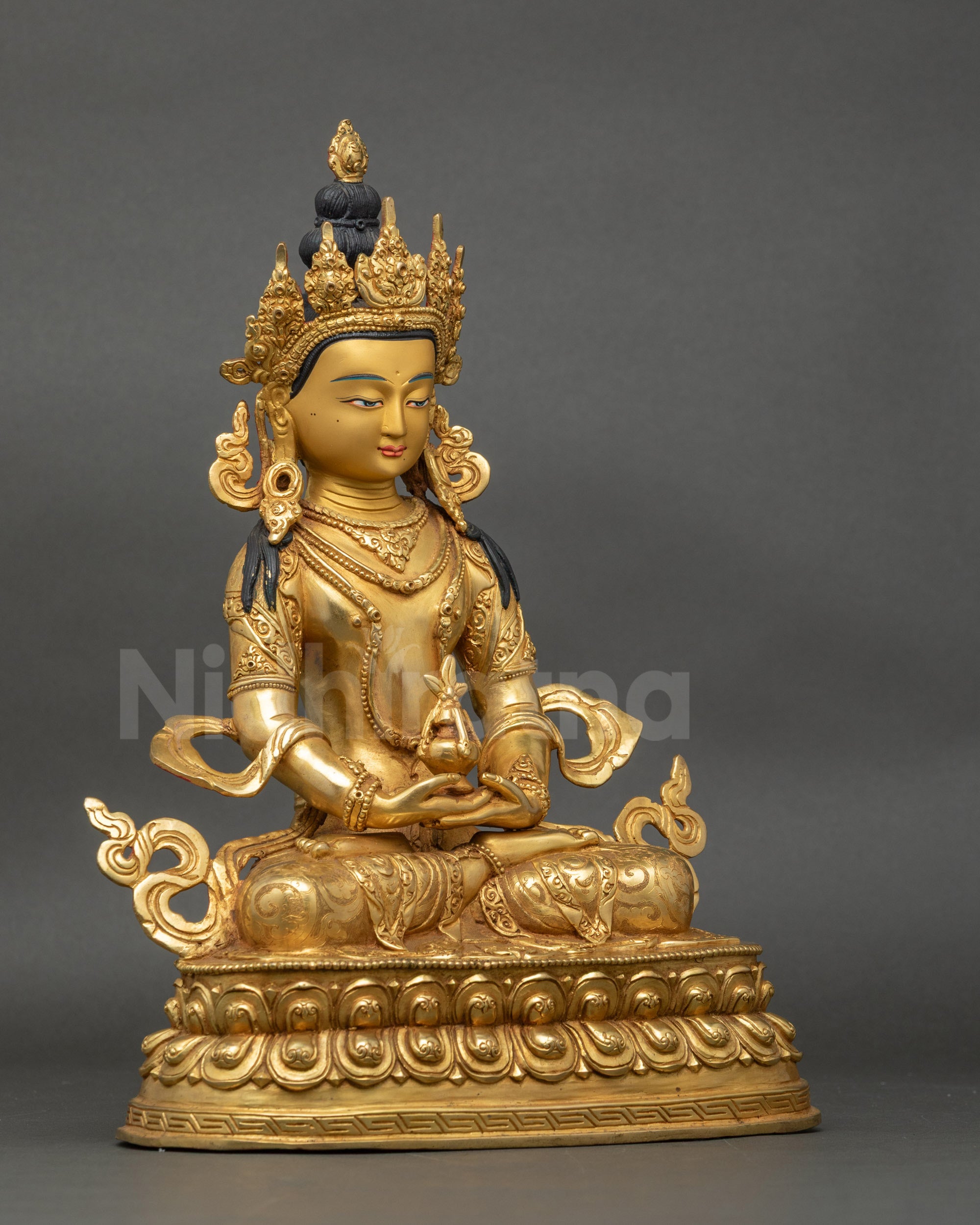 Right profile of Amitayus Bodhisattva, gold-painted face, Tibetan Buddhist sculpture