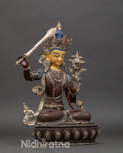 Right profile of Bodhisattva Manjushri statue seated on lotus pedestal