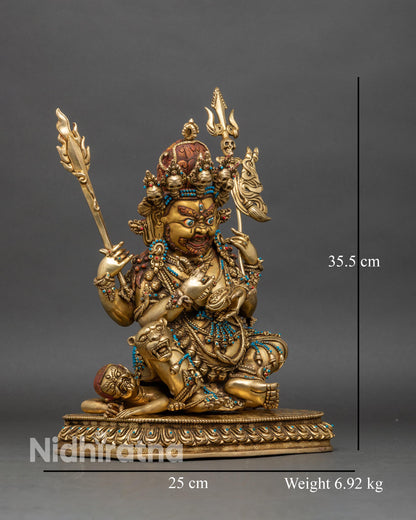 Right profile of Four-Armed Mahakala Statue, wielding sword and trishula on lotus pedestal