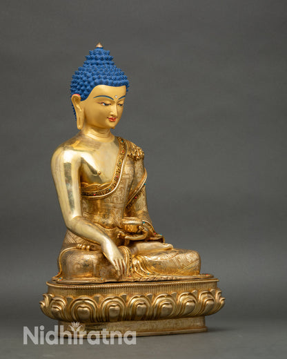 Right profile of Golden Buddha statue on lotus flower pedestal for meditation