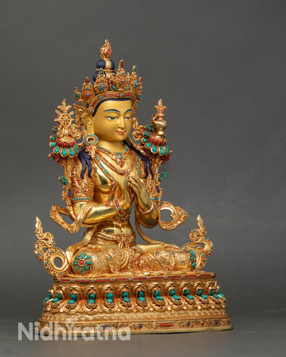 Right profile of Maitreya Buddha in Dharmachakra Mudra holding utpala flowers