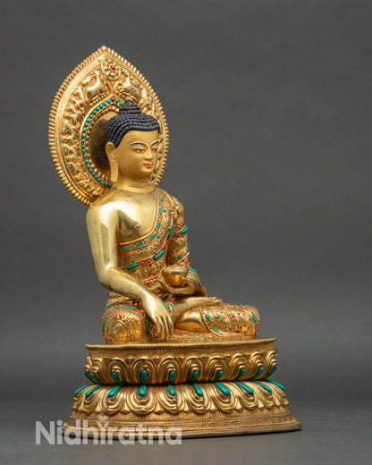 Right profile of Shakyamuni Buddha, copper statue with lotus seat and gilded halo