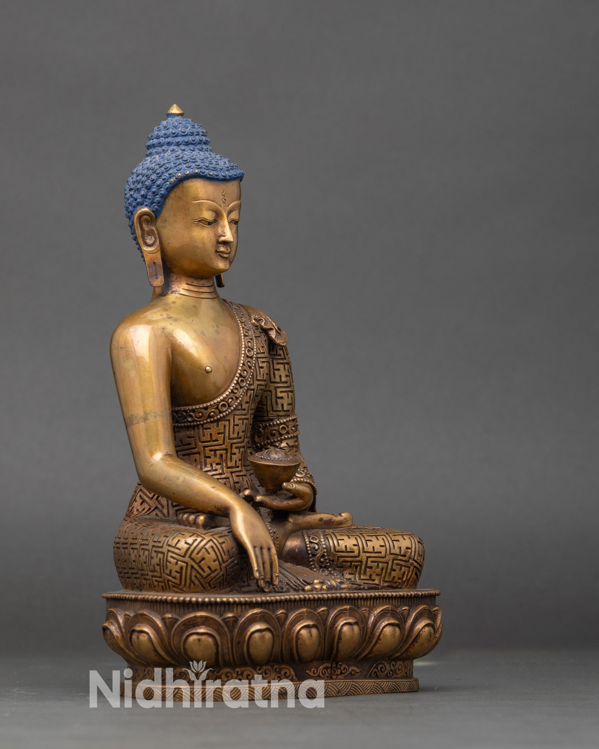 Right profile of Shakyamuni Buddha sculpture with Bhumisparsha Mudra and lotus base