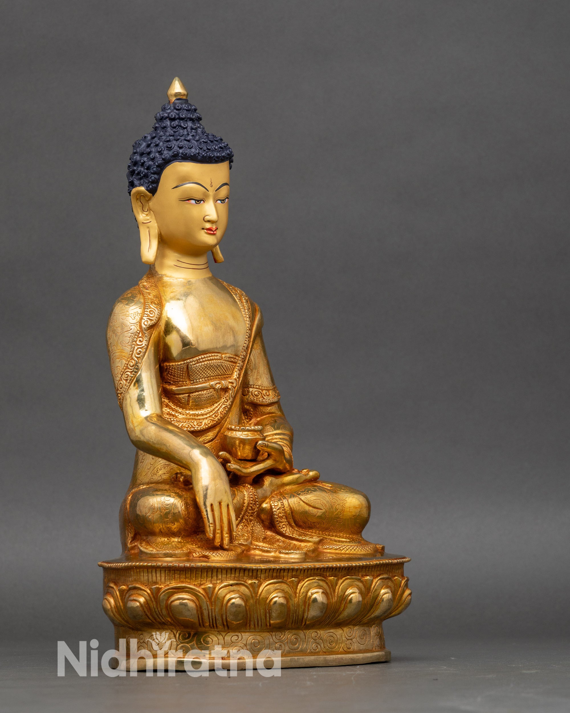 Right profile of Shakyamuni Buddha statue in bhumisparsha mudra for meditation altar