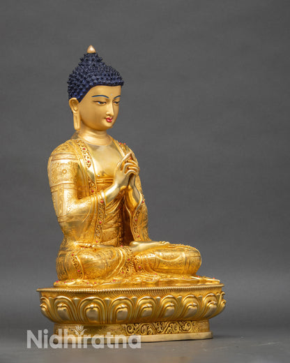Right profile of Vairocana Buddha seated on lotus pedestal with detailed robe