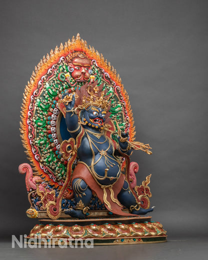 Right profile of Vajrapani Bodhisattva statue displaying gold-gilded robes and symbolic Vajra