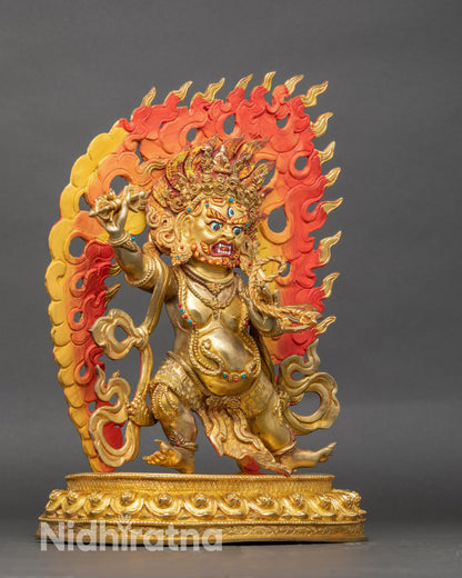 Right profile of Vajrapani statue with lasso, vajra, and flame halo on lotus throne
