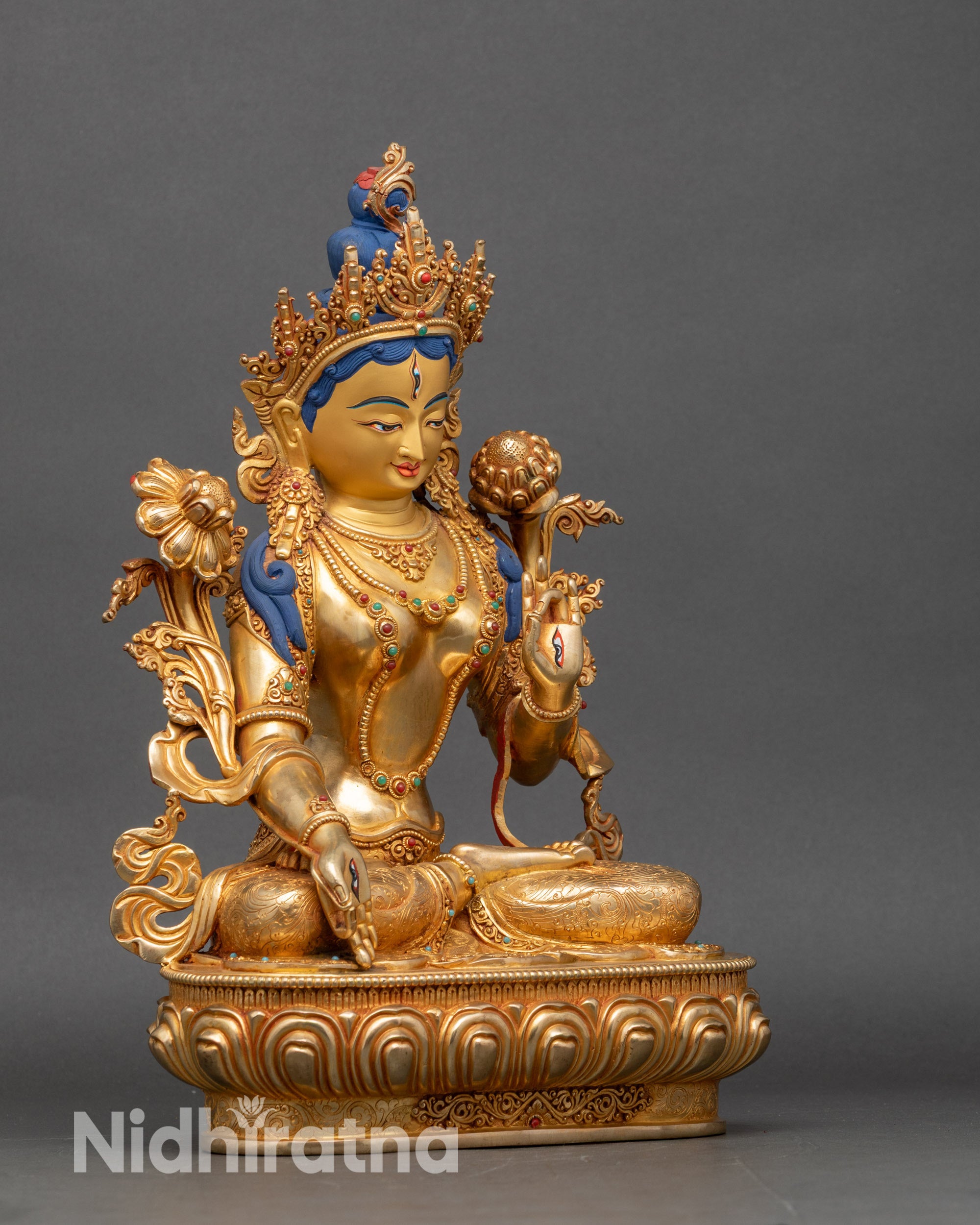 Right profile of White Tara statue, copper and gold Newari Buddhist artwork
