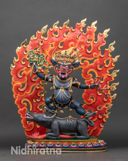 Right profile of Yamantaka statue showing yab-yum union and dynamic posture atop buffalo