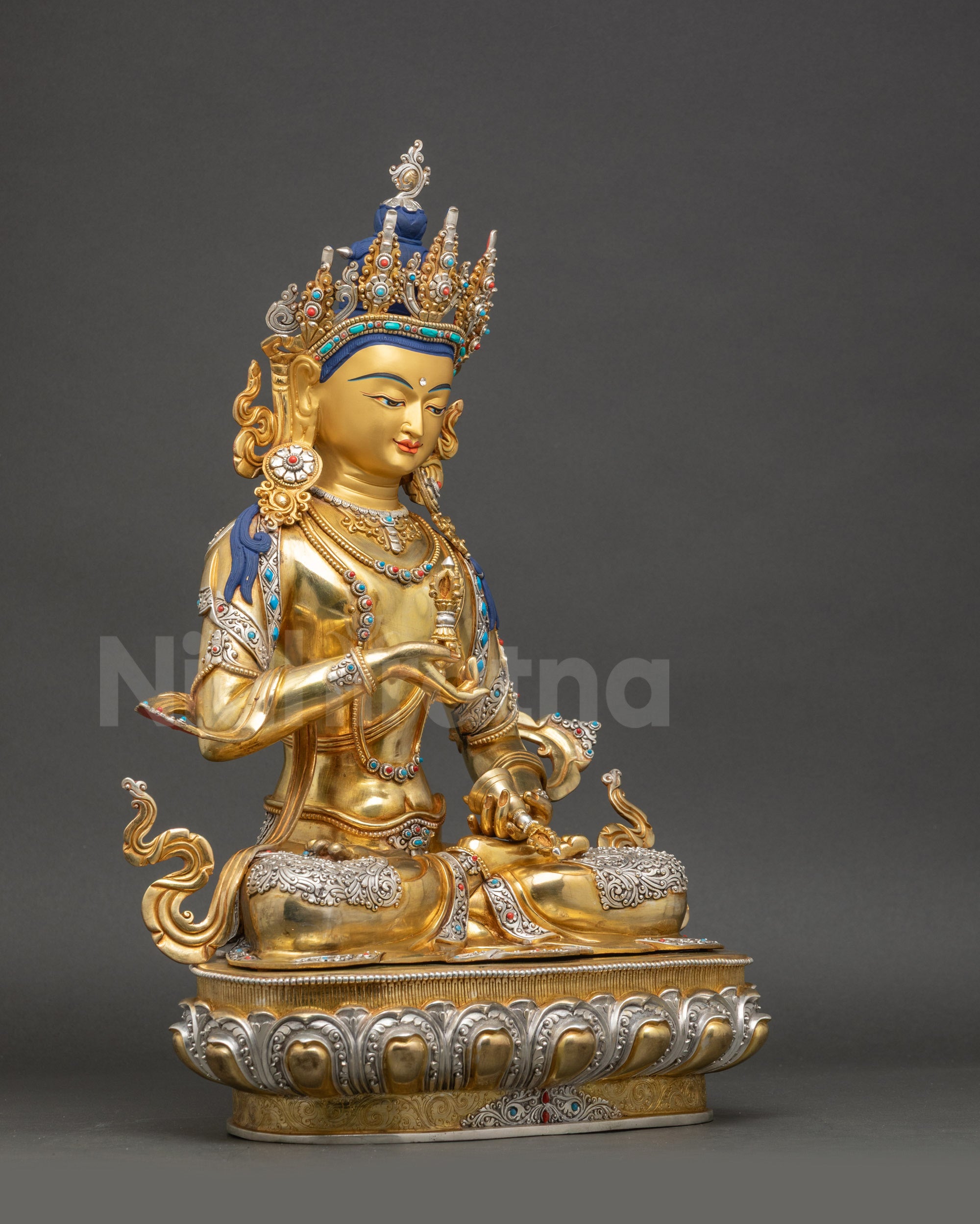 Right side of Dorje Sempa statue lotus seat and flowing gold-gilded garments