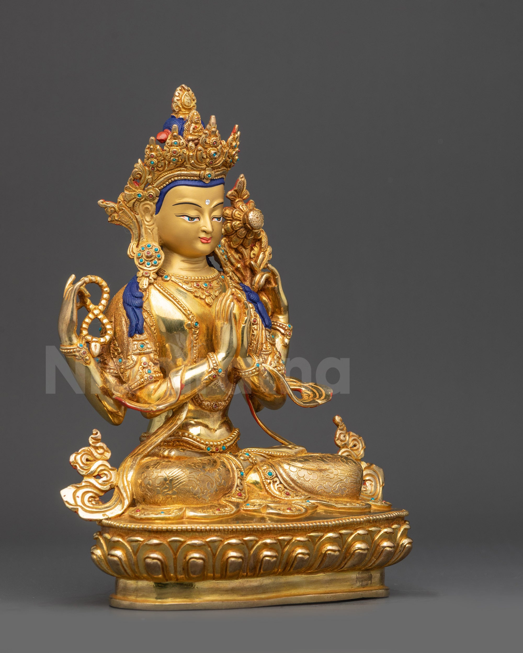 Right side view Chenrezig Buddha Statue on lotus seat with sacred items
