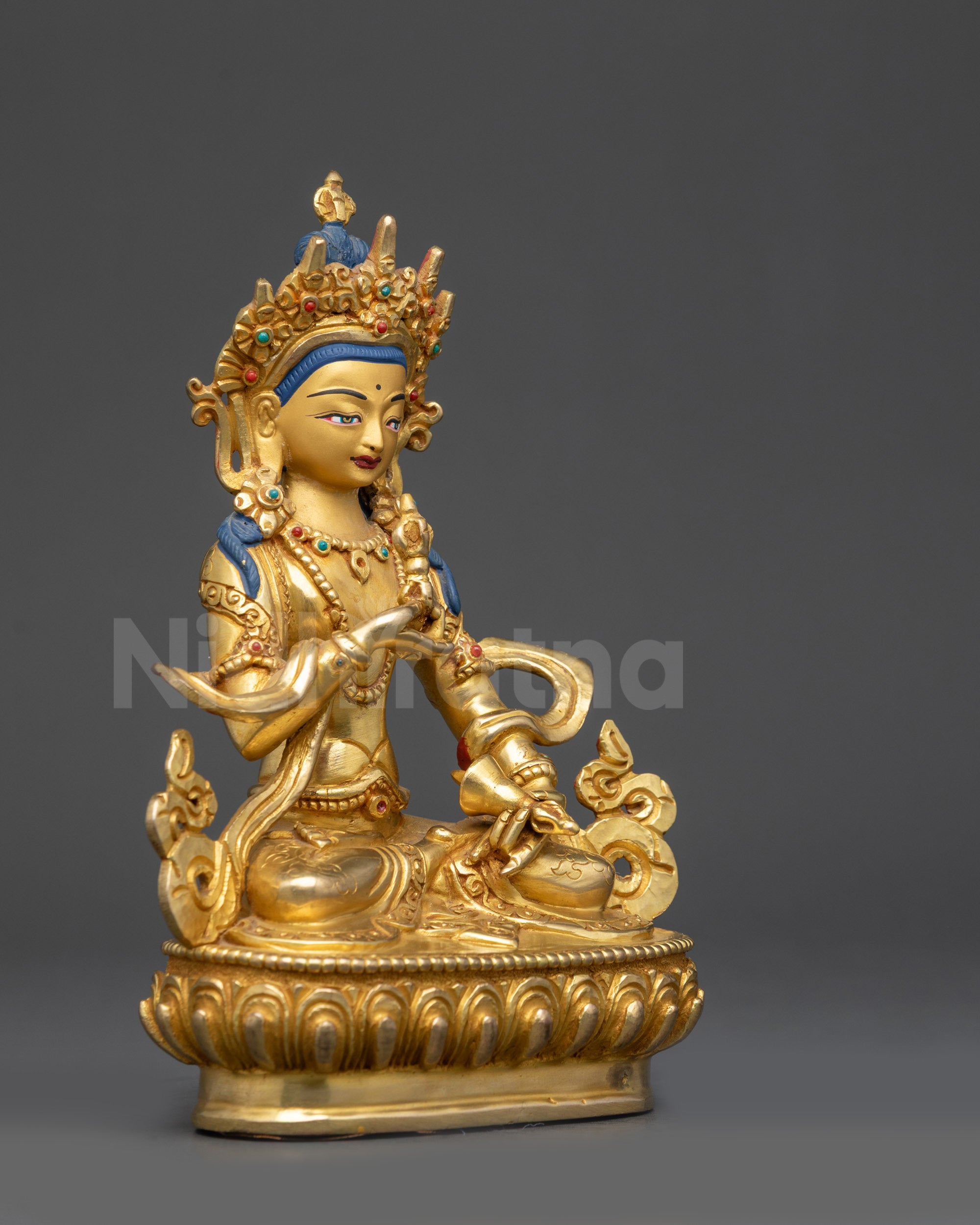 Right side view Dorje Sempa statue with carved lower garment and semi-precious stones
