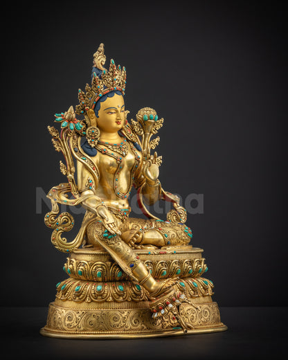 Right side view Green Tara Statue holding utpala stem with detailed gold accents
