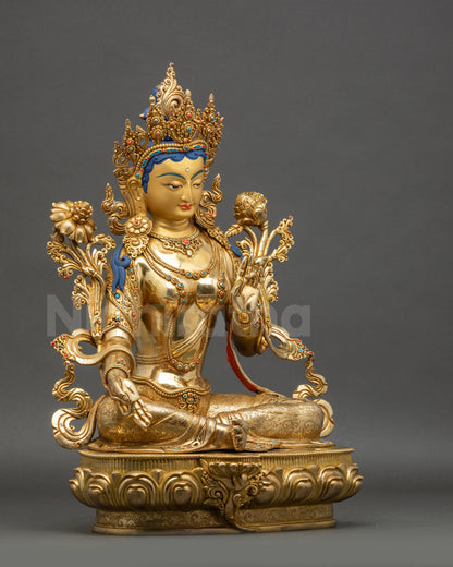 Right side view Green Tara statue seated on lotus gold-gilded copper sculpture
