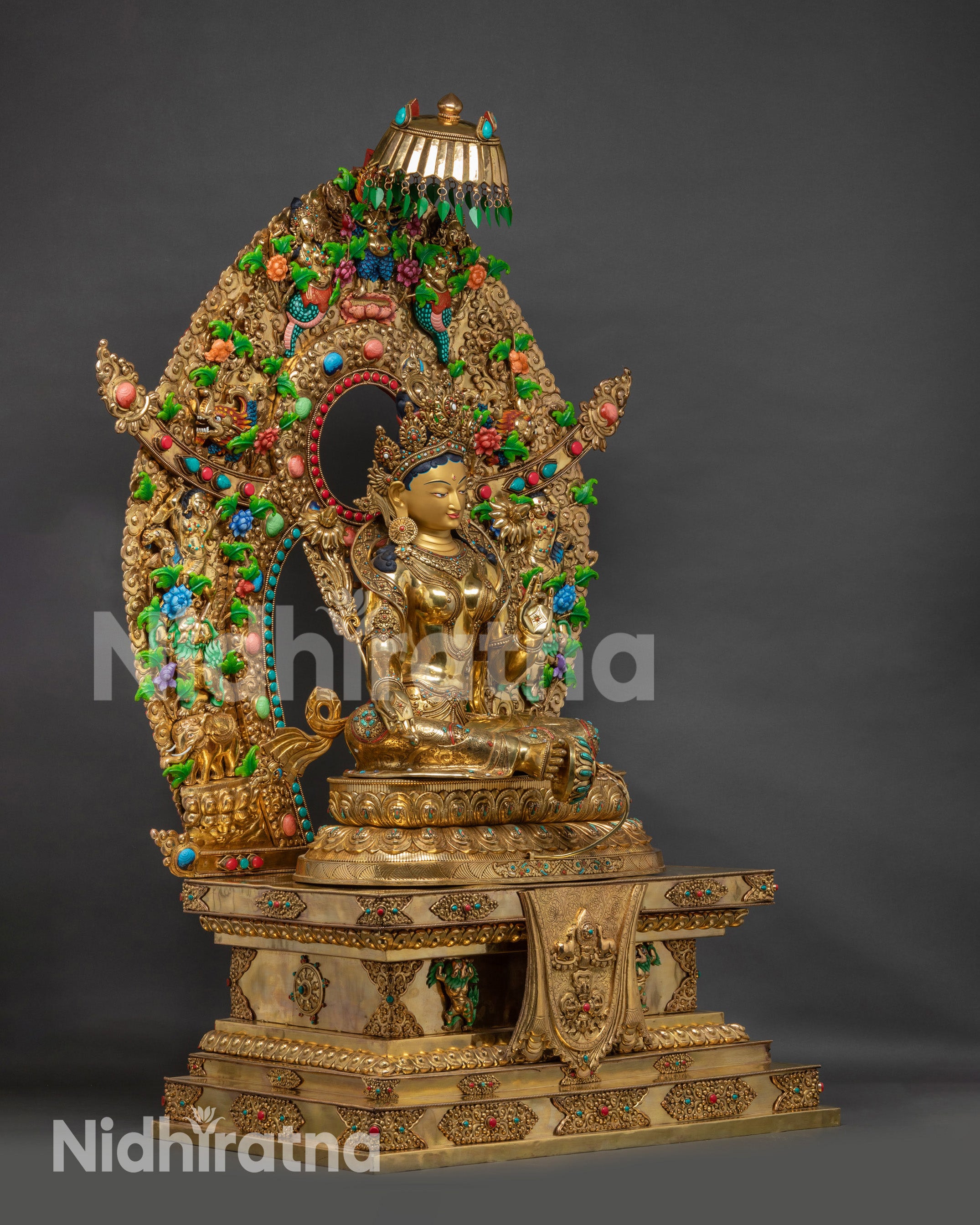 Right side view handcrafted Green Tara Statue on Tibetan Throne with halo
