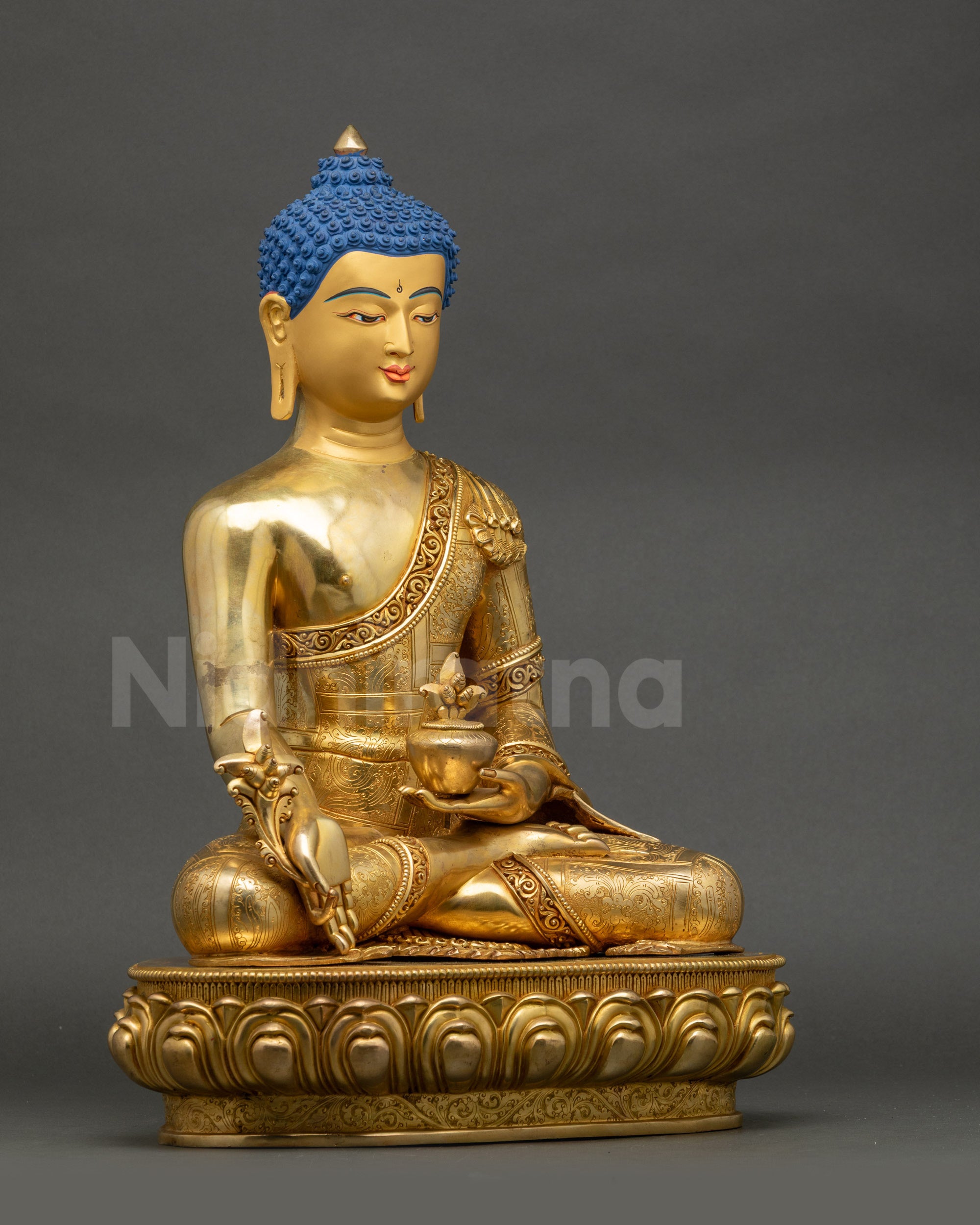 Right side view of 24K gold Medicine Buddha seated on lotus with myrobalan vase