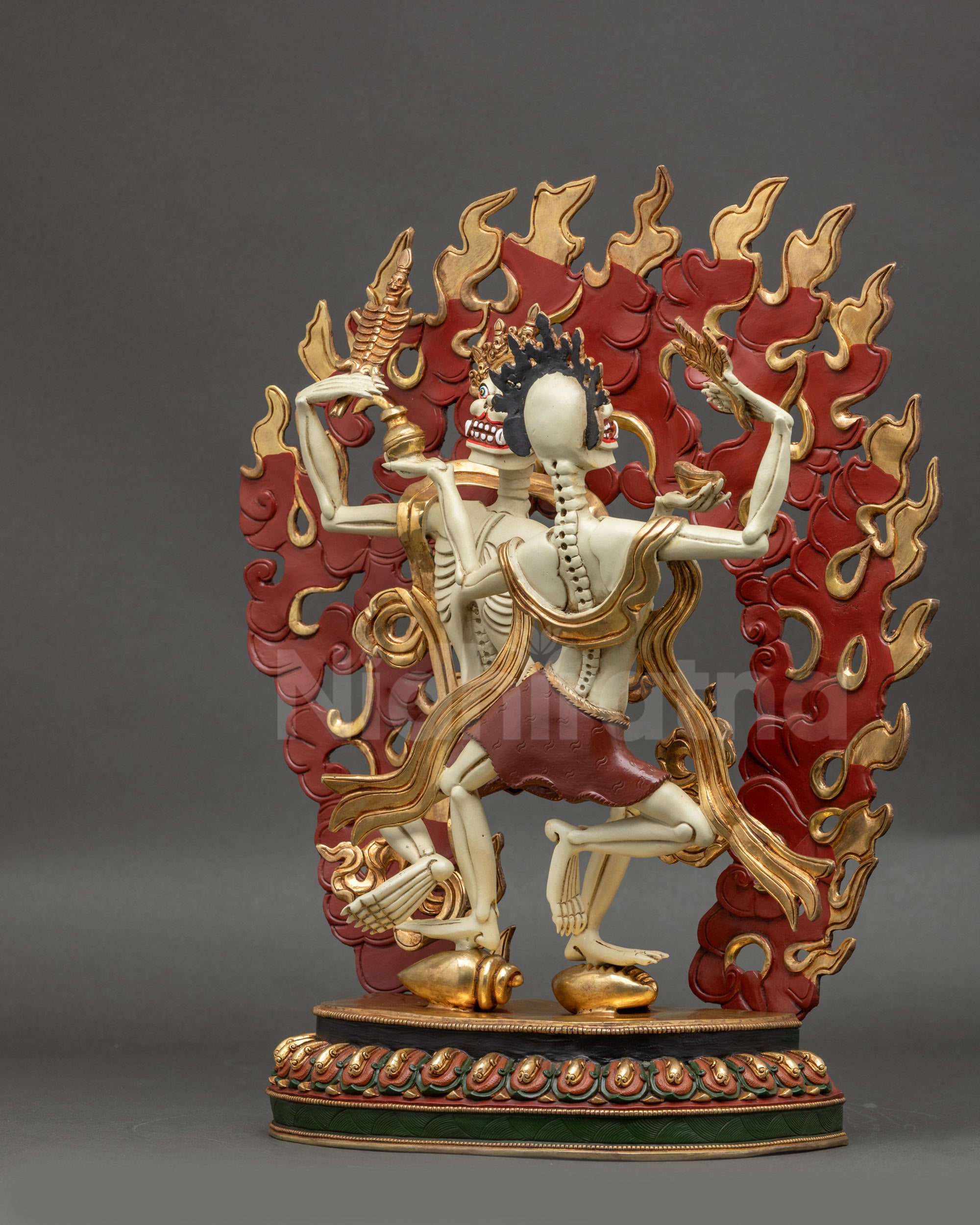 Right side view of Dancing Citipati Sculpture on conch and cowry shell bases