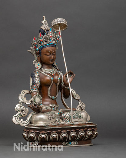 Right side view of Dukar Sitatapatra statue, showing parasol and ornate lotus pedestal