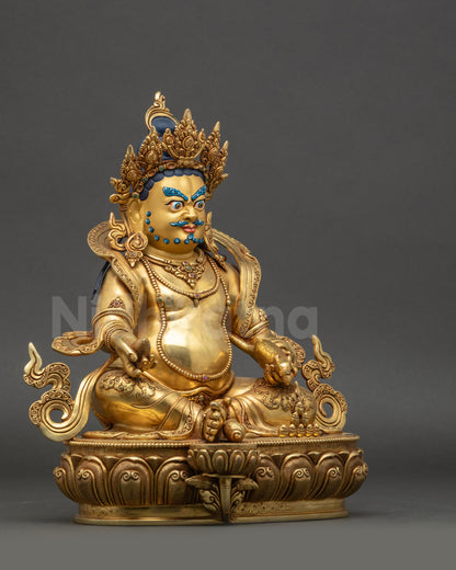 Right side view of Dzambhala Statue on lotus throne with detailed garments