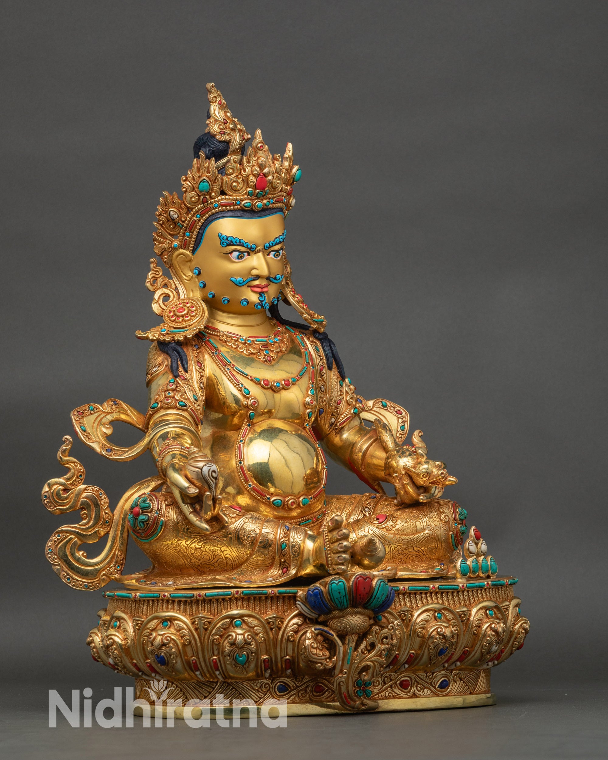 Right side view of Dzambhala wealth god statue with ornate carvings and rich gold finish
