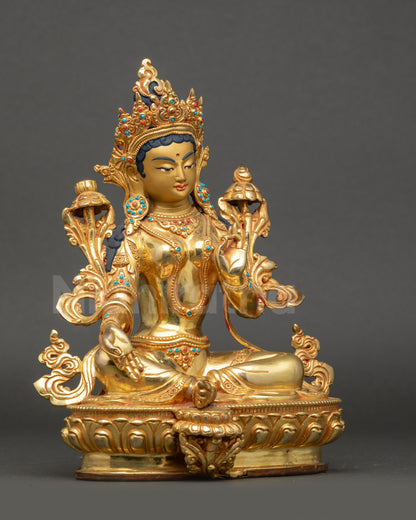 Right side view of Green Tara Statue with lotus seat and blooming utpala flower