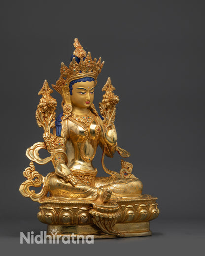 Right side view of Green Tara statue with Utpala flower and Varada mudra