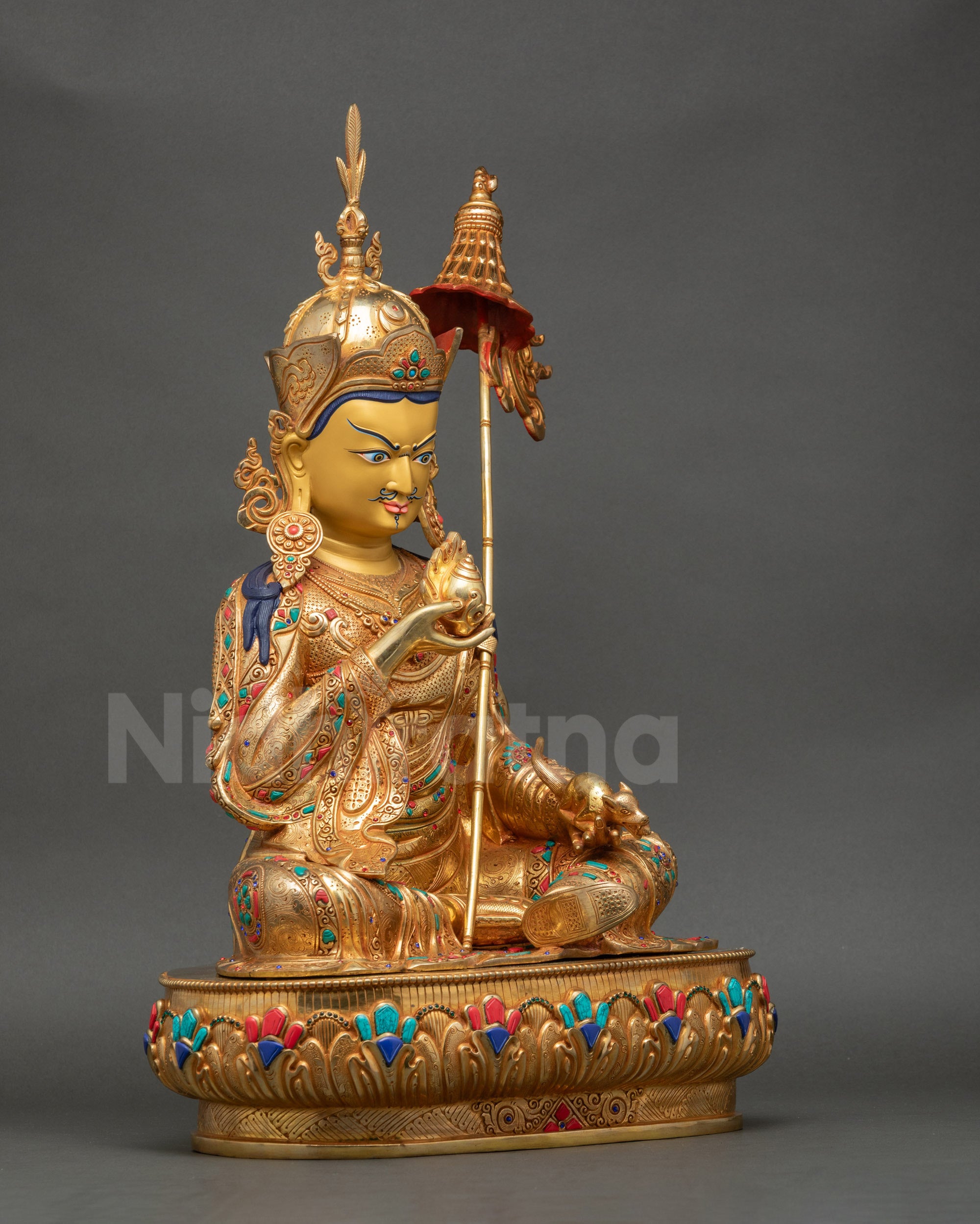 Right side view of Guru Norlha Statue highlighting hand-carved royal kasaya garments and semi-precious stones