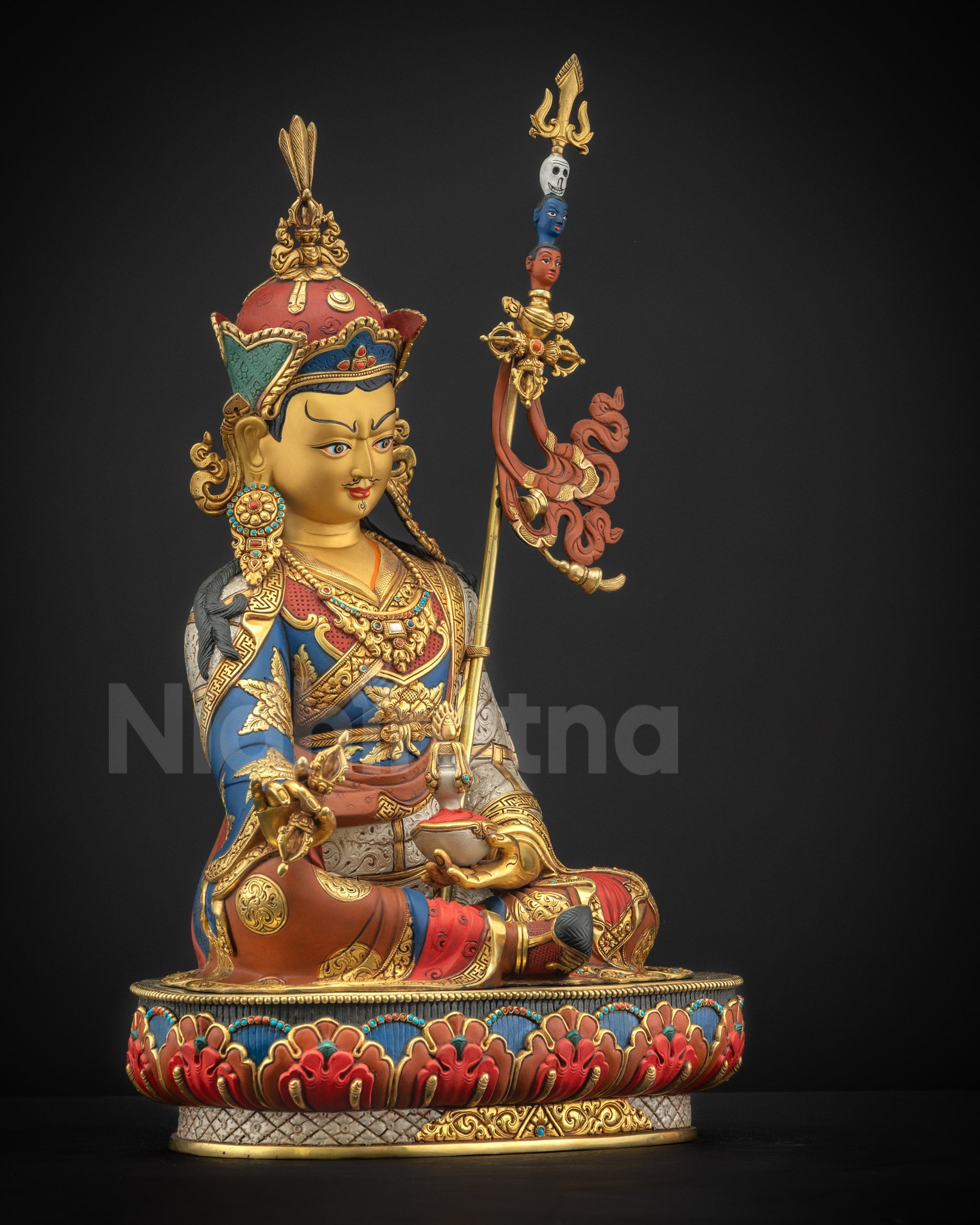 Right side view of Guru Padmasambhava statue holding vajra (Dorje) and skull cup