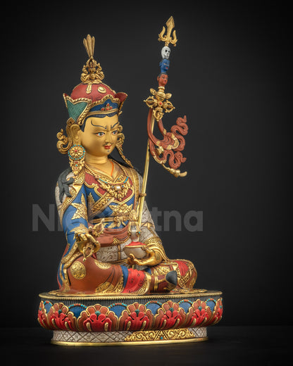 Right side view of Guru Padmasambhava statue holding vajra (Dorje) and skull cup