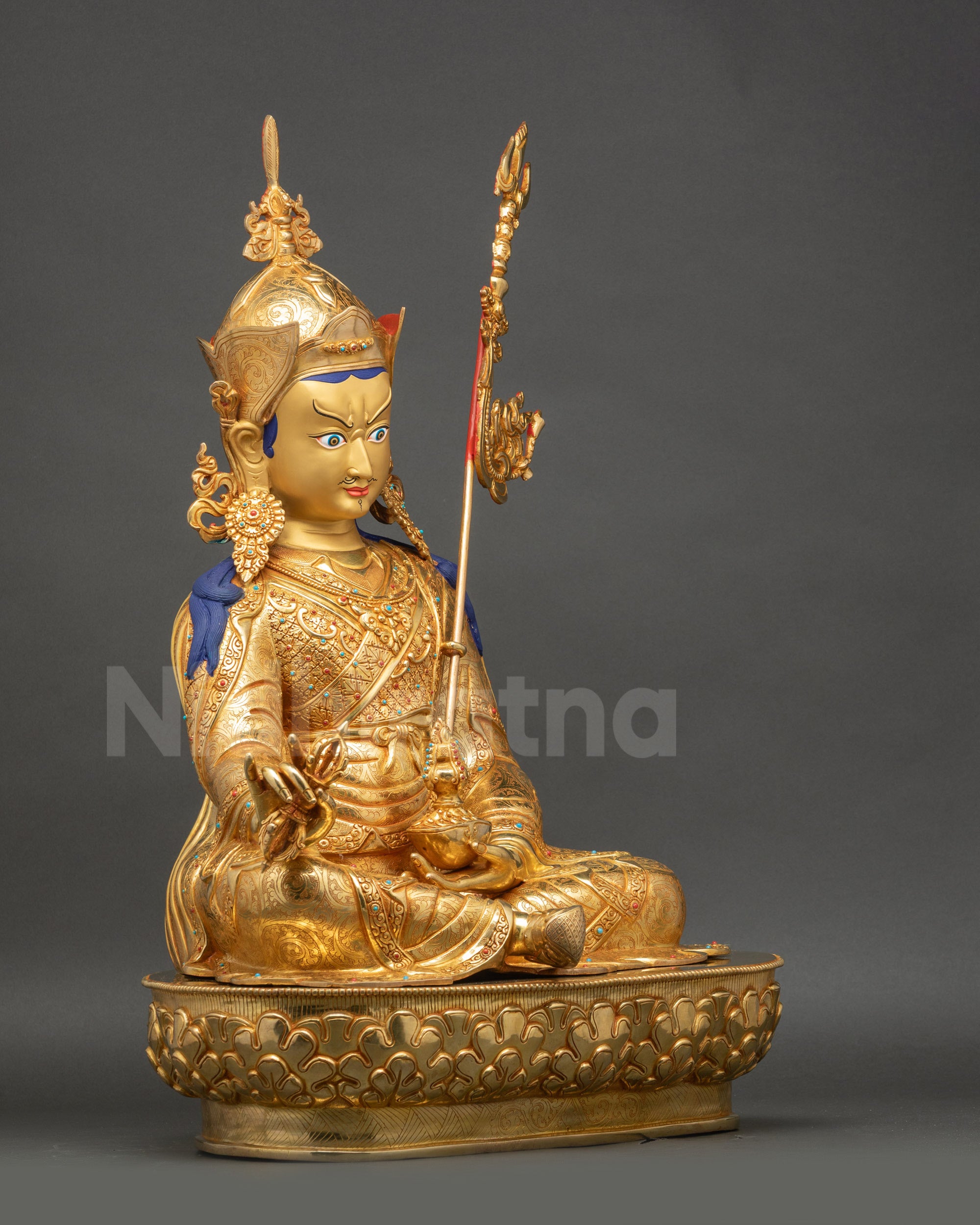 Right side view of Guru Rinpoche Statue showcasing traditional Vajrayana attributes and posture