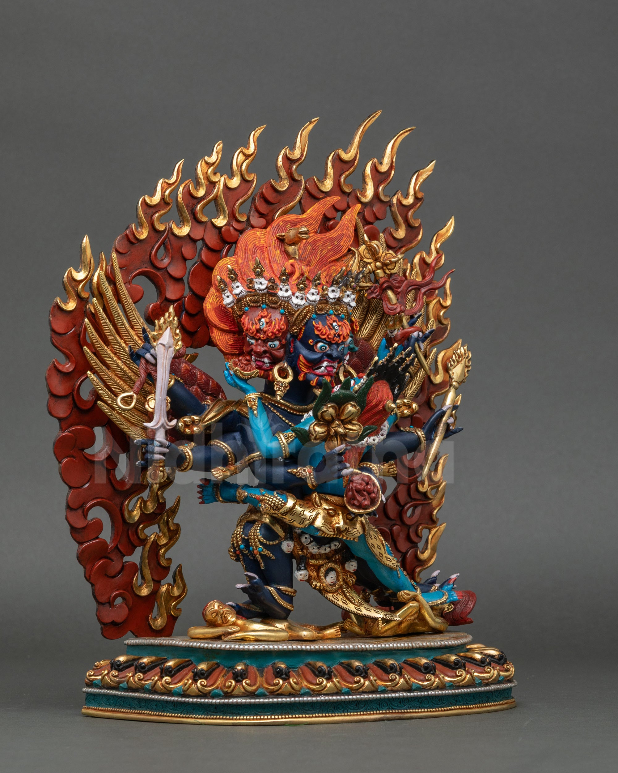Right side view of Hayagriva statue showing dynamic posture and lotus base