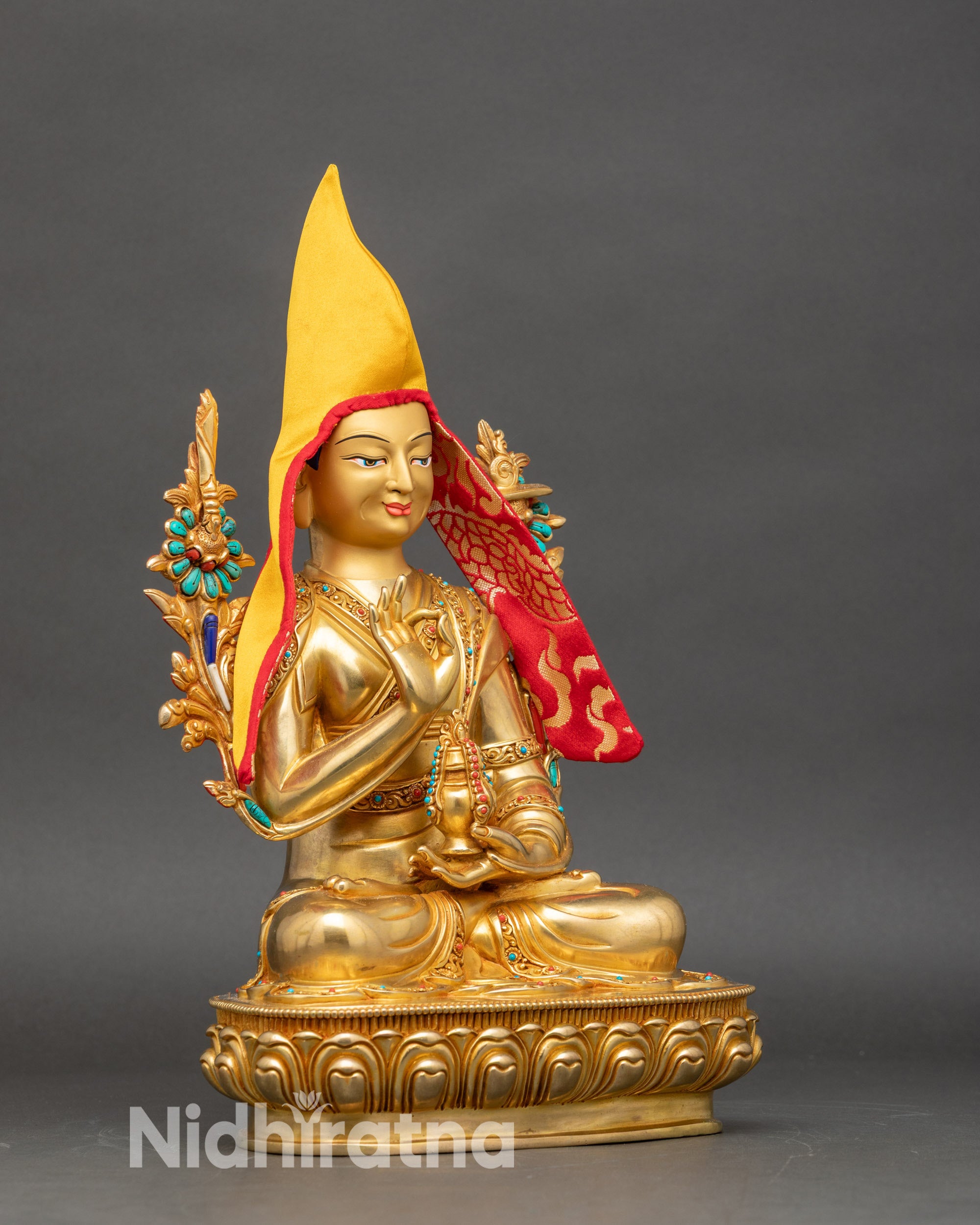 Right side view of Je Tsongkhapa statue, traditional Nepalese Buddhist altar sculpture with ritual vase