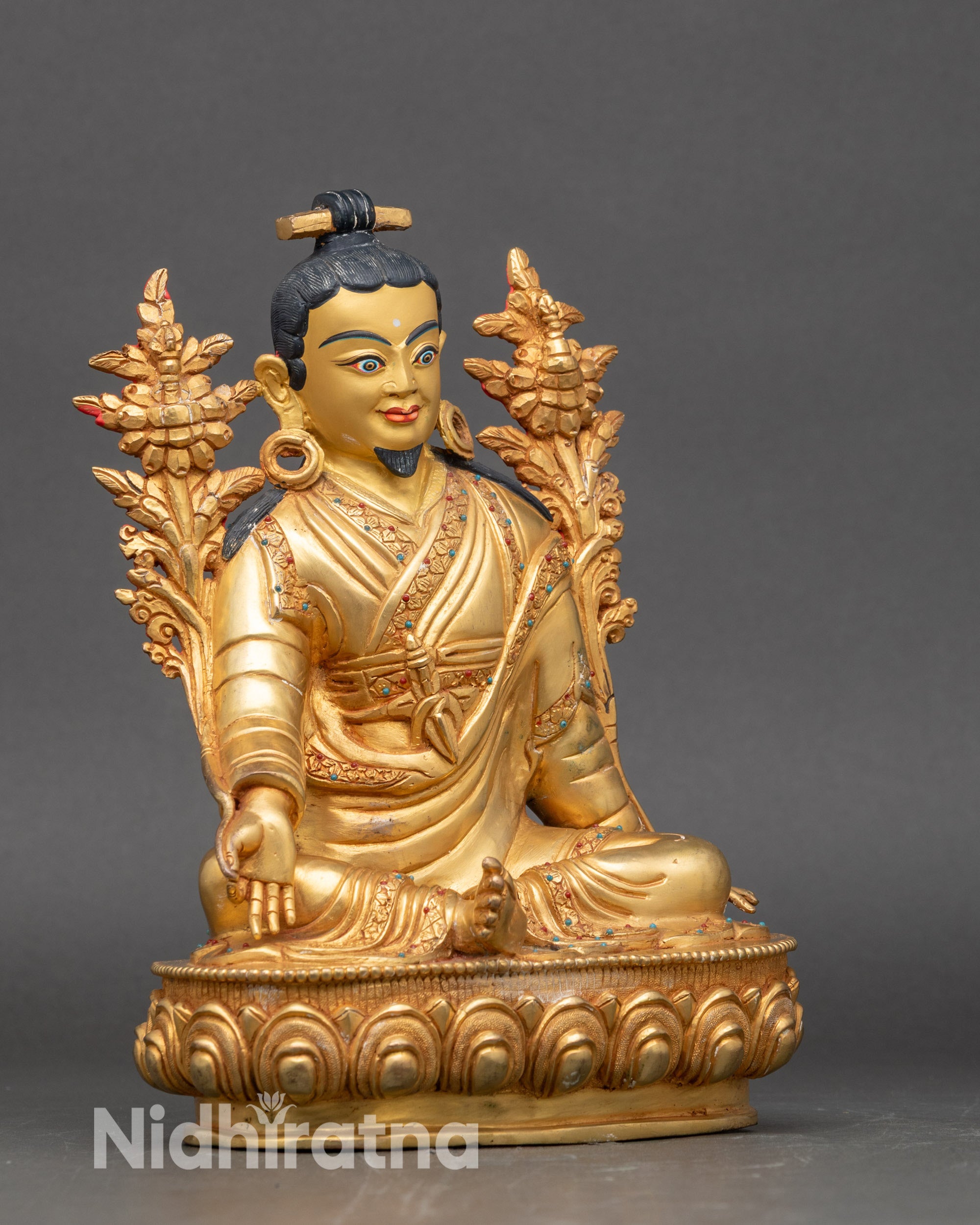 Right side view of Jigme Lingpa sculpture, copper body with semi-precious stones