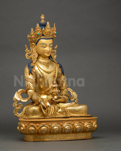 Right side view of Jizo Kshitigarbha statue seated in lotus pose on pedestal