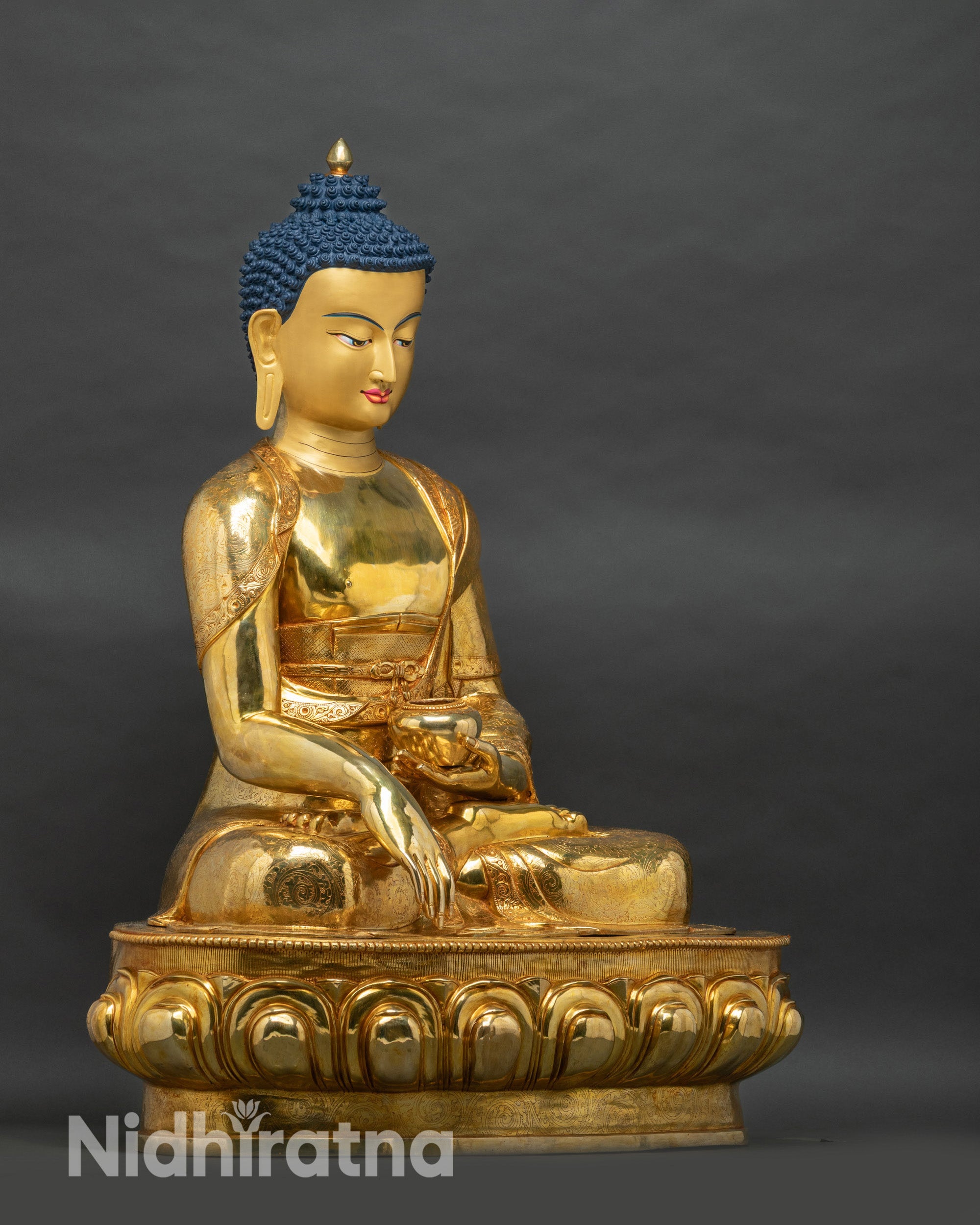 Right side view of Large-Size gold Shakyamuni Buddha statue showing earth-touching hand and robe detail