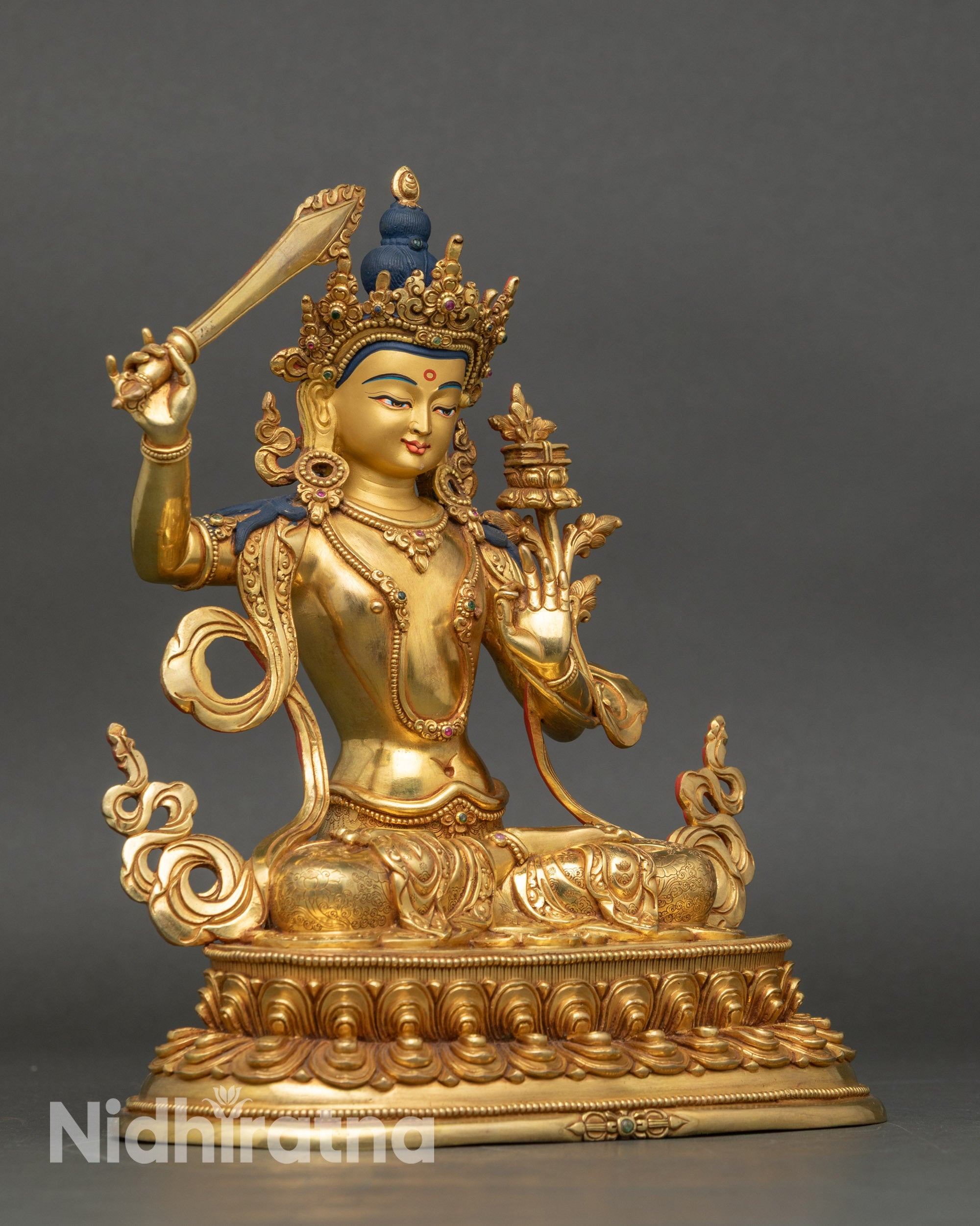 Right side view of Manjushri Statue, copper and fire-gilded Buddhist artwork