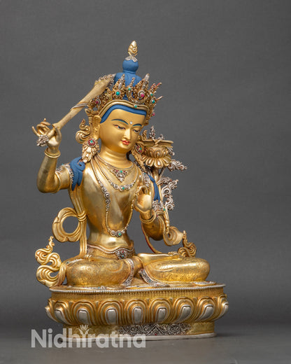 Right side view of Manjushri Statue, seated copper Bodhisattva with gold and silver plating