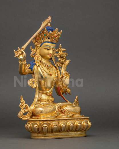 Right side view of Manjushri statue holding utpala flower and wisdom sword