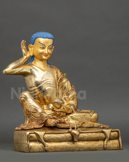 Right side view of Milarepa statue highlighting kapala and deer skin pedestal