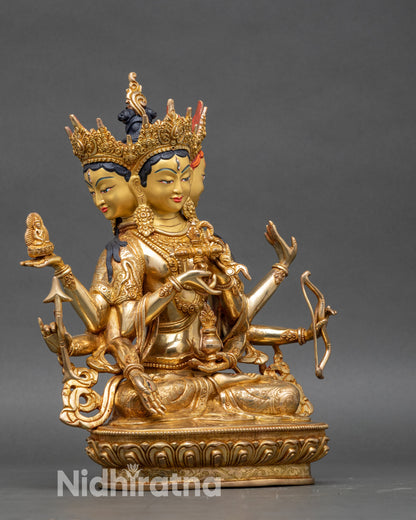 Right side view of Namgyalma statue with flowing robes and ritual objects