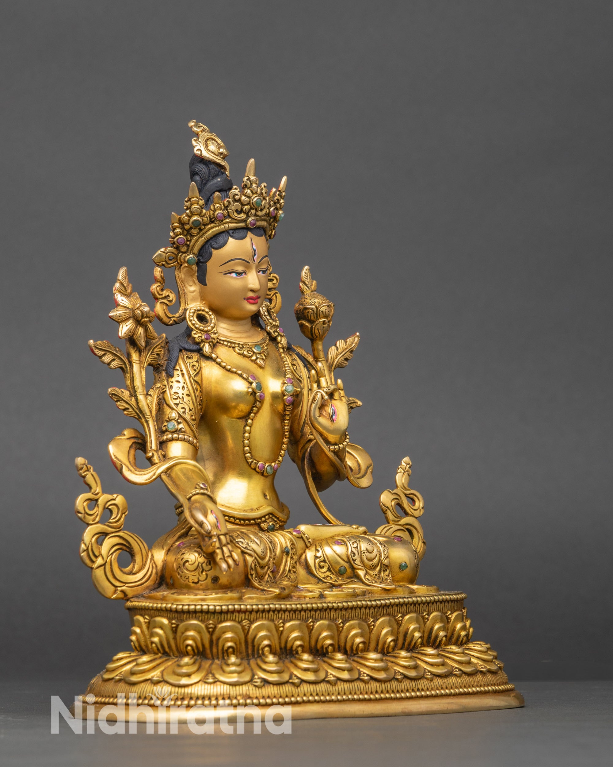 Right side view of Seven Eyed White Tara Statue seated on lotus pedestal, gold-gilded Nepalese Buddhist sculpture