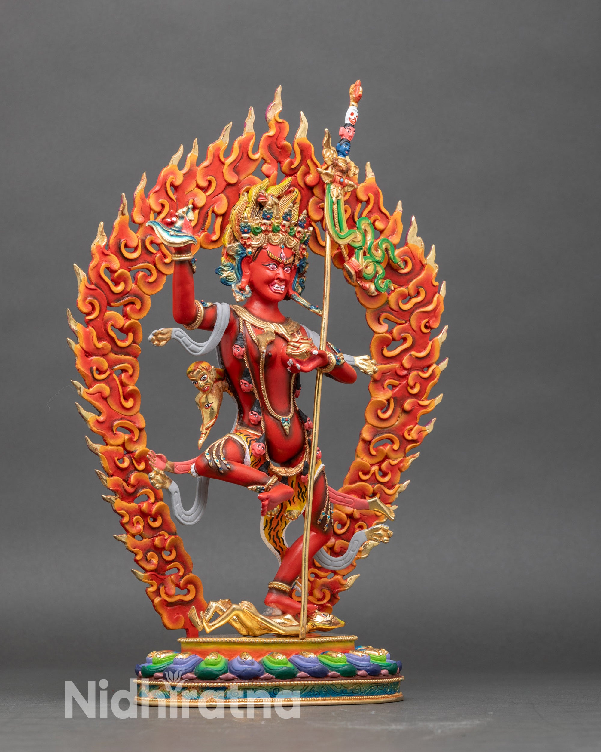 Right side view of Troma Nagmo, lotus seat and subdued human figure detail