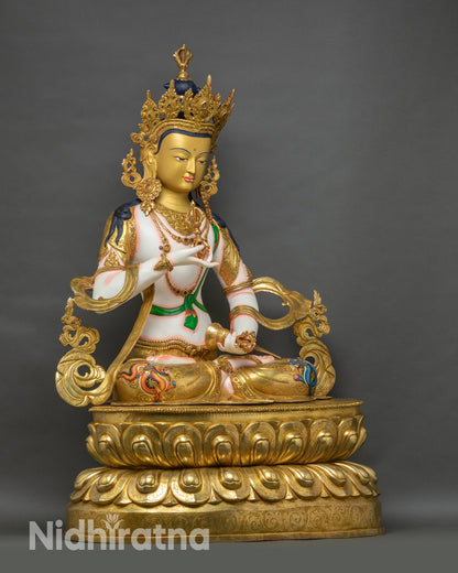 Right side view of Vajrasattva statue seated on double-layered lotus with gilded accents