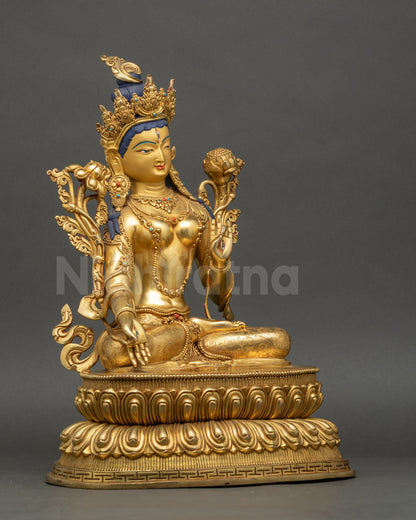 Right side view of White Tara Statue seated on double-lotus with utpala flower