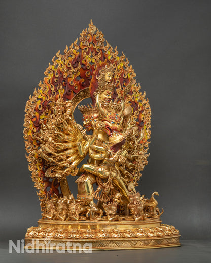 Right side view of Yamantaka union statue with multiple arms and ritual objects