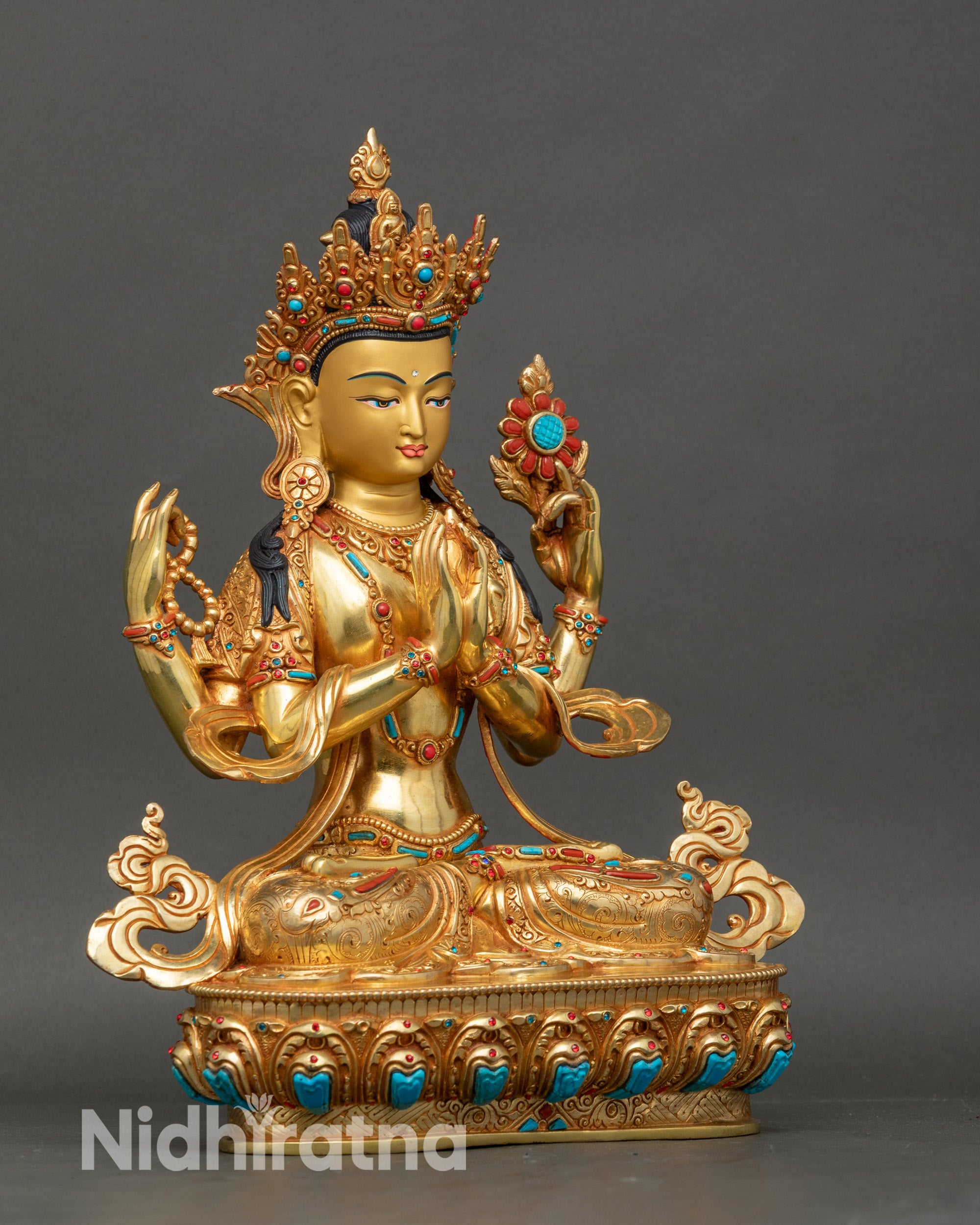 Right side view of four-armed Chenrezig fire-gilded Himalayan sculpture
