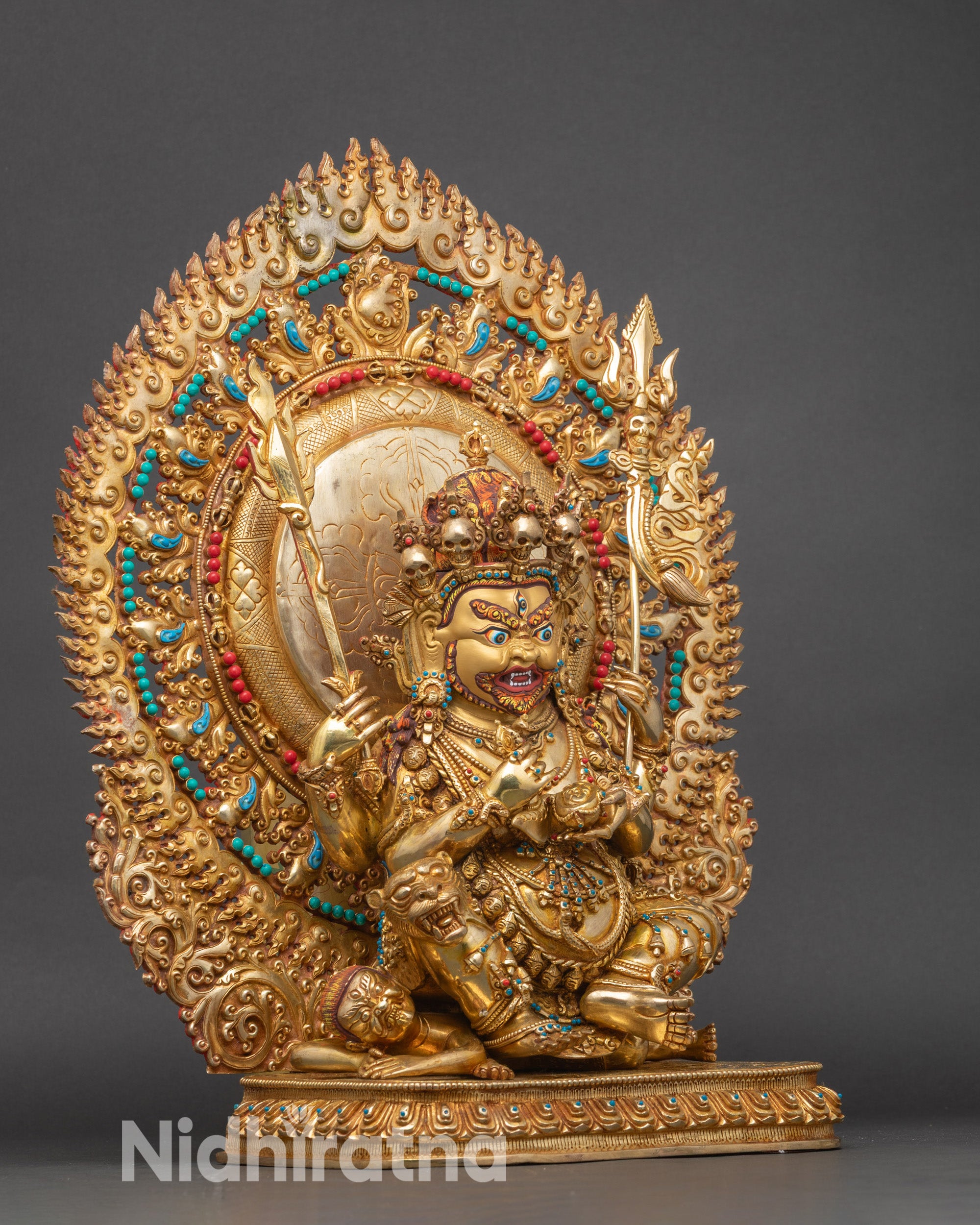 Right view of Four-Armed Mahakala on lotus, subduing demon, gold gilded.