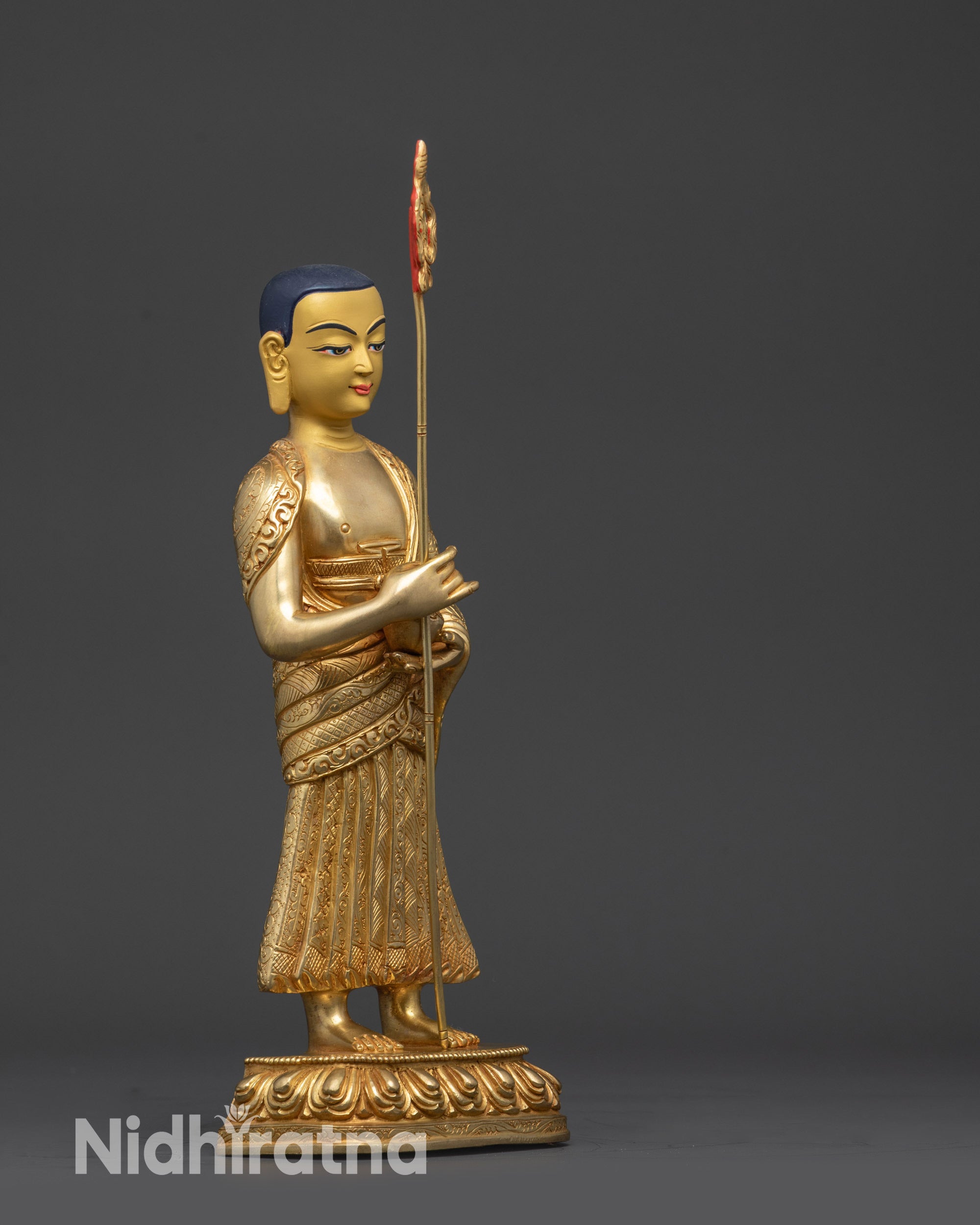 Right view side Buddha disciples statue right side view ritual staff and patra bowl
